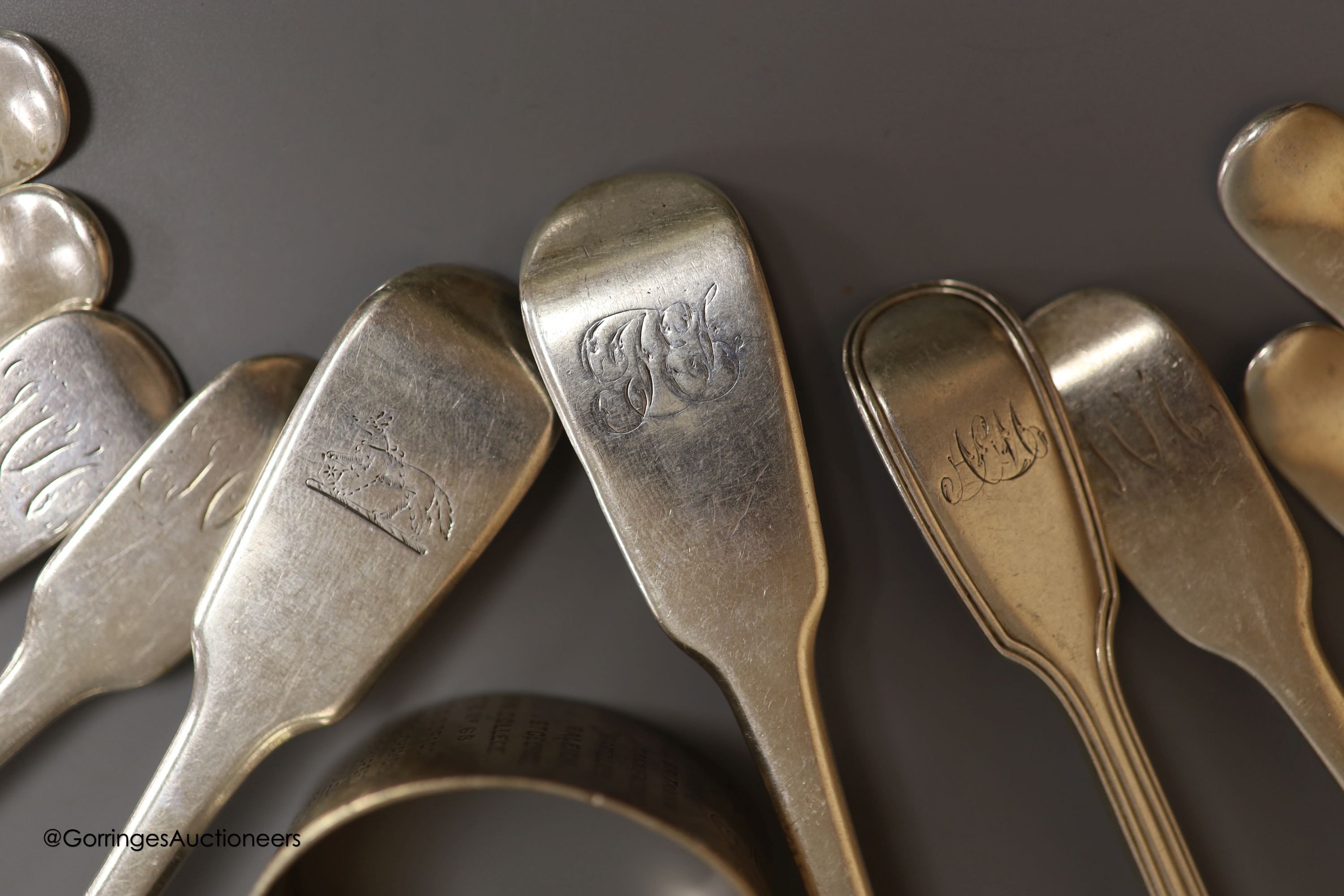 Four George III silver forks, six spoons, a later bottle coaster and a napkin ring